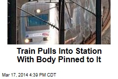Train Pulls Into Station With Body Pinned to It