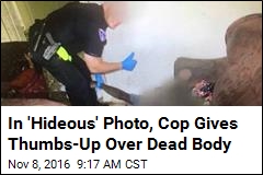 In &#39;Hideous&#39; Photo, Cop Gives Thumbs-Up Over Dead Body