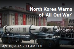 North Korea Parades Missiles, Warns of War