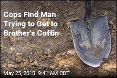 Cops Find Man Digging Up Brother&#39;s Grave