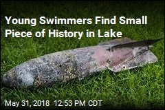 Girls Playing in Lake Discover WWI Practice Bomb