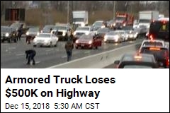Armored Truck Loses $500K on Highway