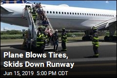 Plane Blows Tires, Skids Down Runway