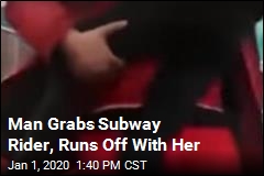 Man Grabs Subway Rider, Runs Off With Her