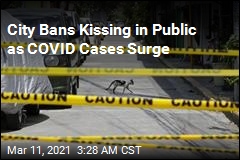 City Bans Kissing in Public as COVID Cases Surge