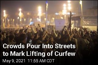 Crowds Pour Into Streets to Mark Lifting of Curfew