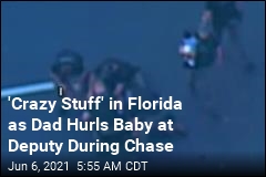 Cops: As We Pursued Suspect, He Hurled His Baby at Us