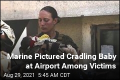 Marine Pictured Cradling Baby at Airport Among Victims