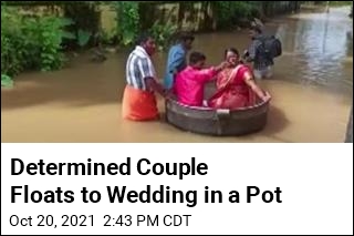 Determined Couple Floats to Wedding in a Pot