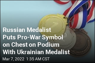 Russian Medalist Puts Pro-War Symbol on Chest, Stands Next to Ukrainian Medalist