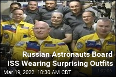 Russian Astronauts Board ISS Sporting Blue and Yellow