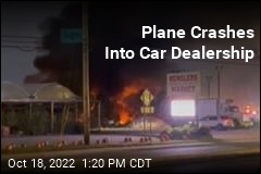Plane Crashes Into Car Dealership