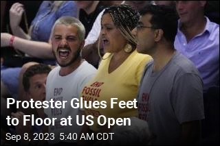Protester Glues Feet to Floor at US Open