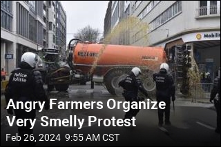 Angry Farmers Spray Poop on Cops