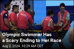 Olympic Swimmer Emerges From Pool, Collapses