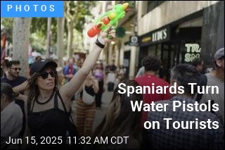 Protesters Spritz Tourists