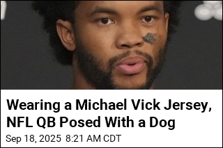 QB Sorry for Wearing Vick Jersey While Posing With Dog