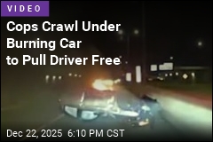 Cops Crawl Under Burning Car to Pull Driver Free
