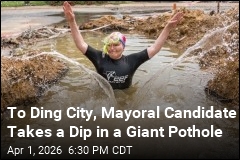 To Zing City, Mayoral Candidate Takes a Dip in a Giant Pothole