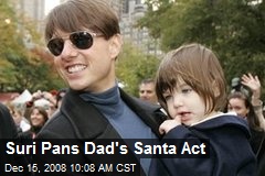 Suri Pans Dad's Santa Act