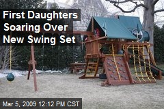 First Daughters Soaring Over New Swing Set